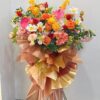 orange & red color artificial flowers grand opening stand