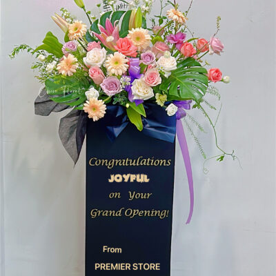colorful grand opening flowers stand with messages on board