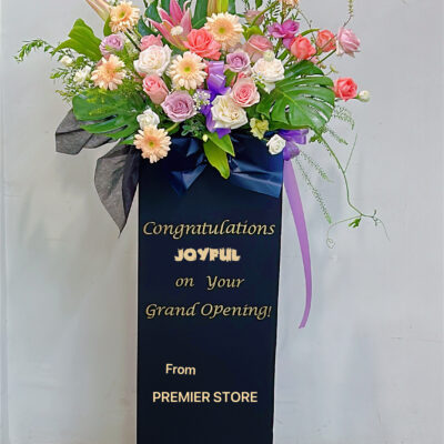 colorful grand opening flowers stand with messages on board