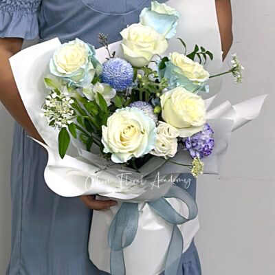 a person holding a bouquet of flowers